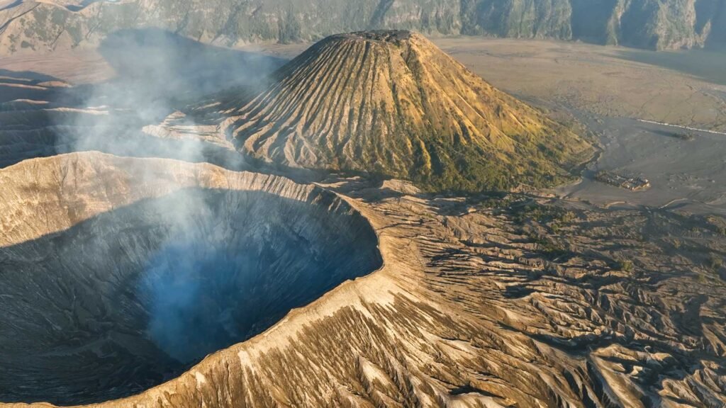 A aerial view of the Mount Bromo caldera captured by a drone, showcasing the unique scale and perspective for bromo volcano photography.