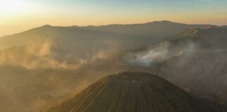 A spectacular view of the active volcano and the Sea of Sand during a Mount Bromo sunrise tour